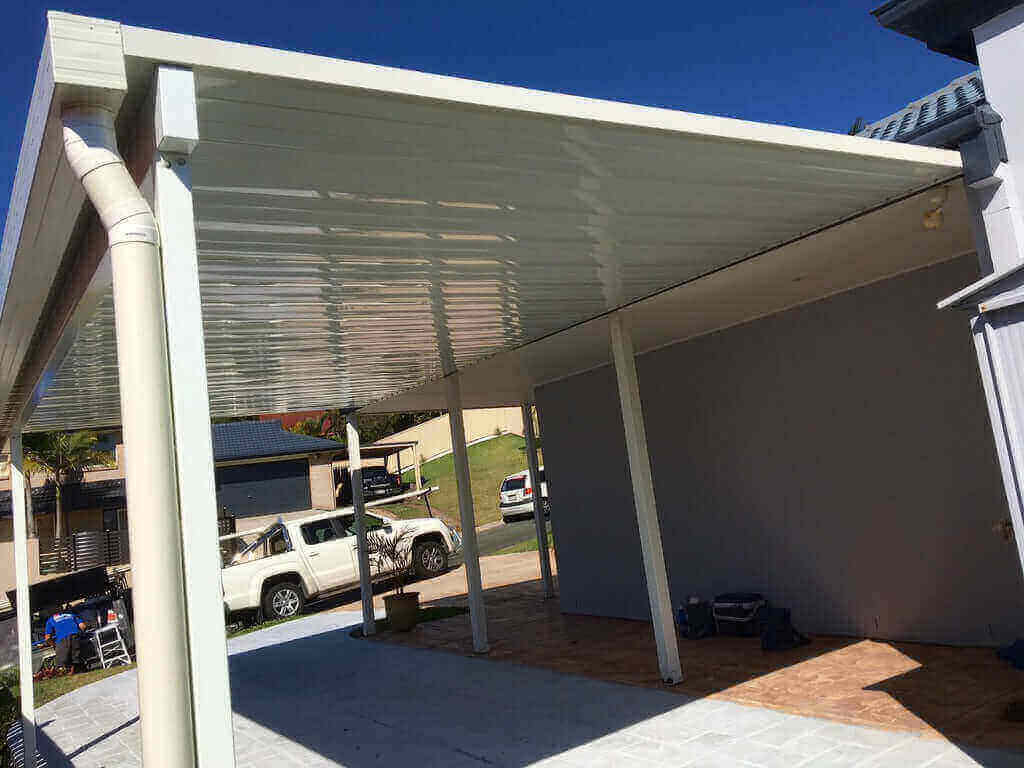 Single skin V-Line patio roof attached to house with steel posts, providing durable patio roofing and covered outdoor living space for an Australian home.
