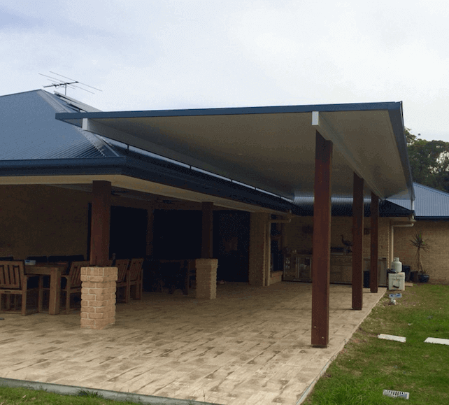 Spacious Merbau timber posts designed to harmonize with existing timber, with a clean concrete base for the full structure and home integration.