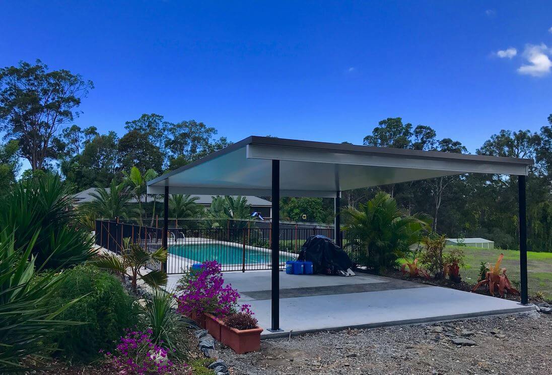 Modern insulated patio carport harmonizing with the poolside patio roof, providing shelter, comfort, and a chic outdoor entertainment space.