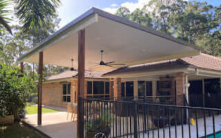 Modern reversed Insulated flyover patio or carport with sturdy timber posts, designed for a spacious and stylish outdoor area.