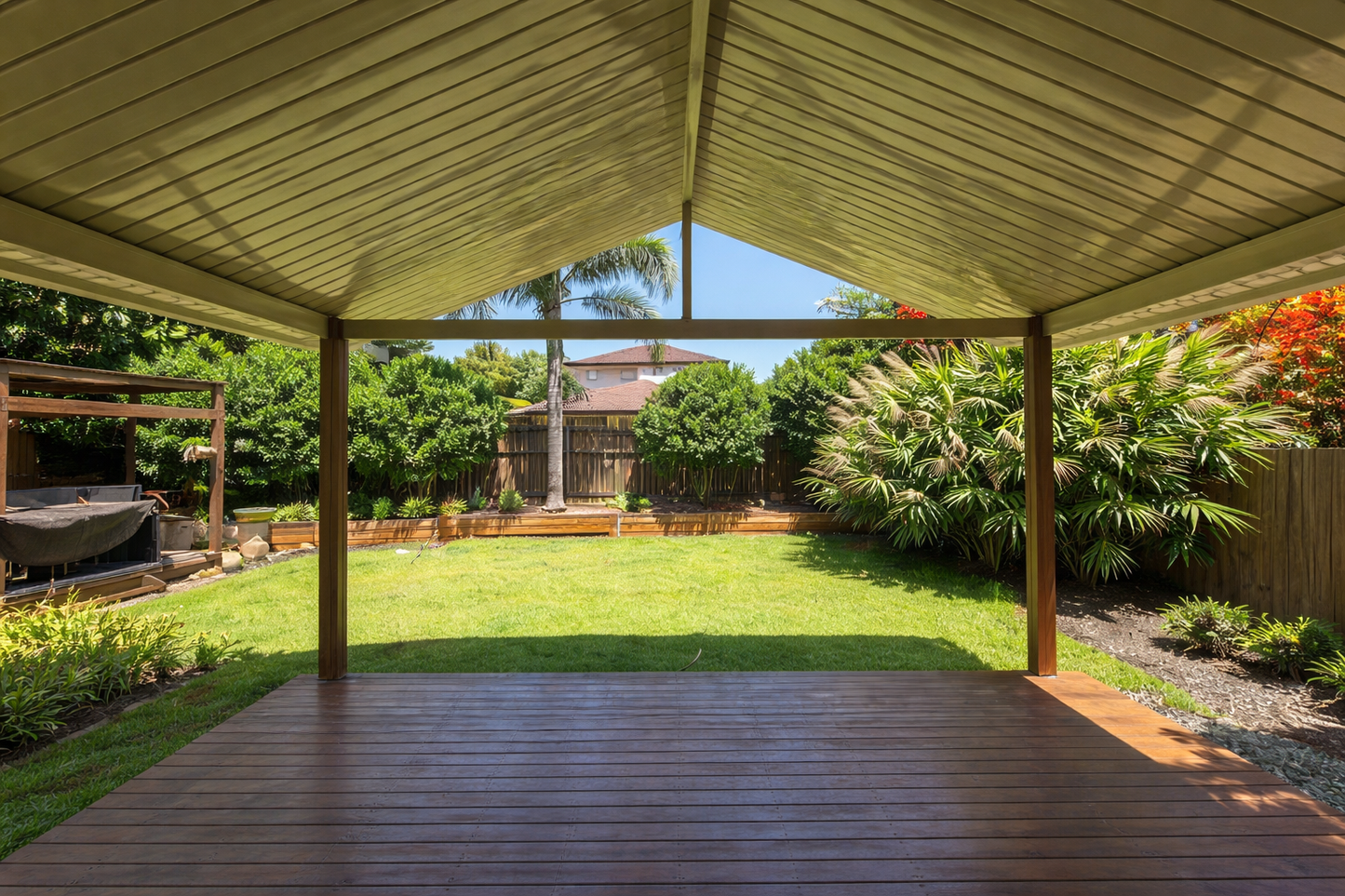 Gable-style patio roof with a pitched metal design - structured support for durable overhead coverage with a stylish finish.