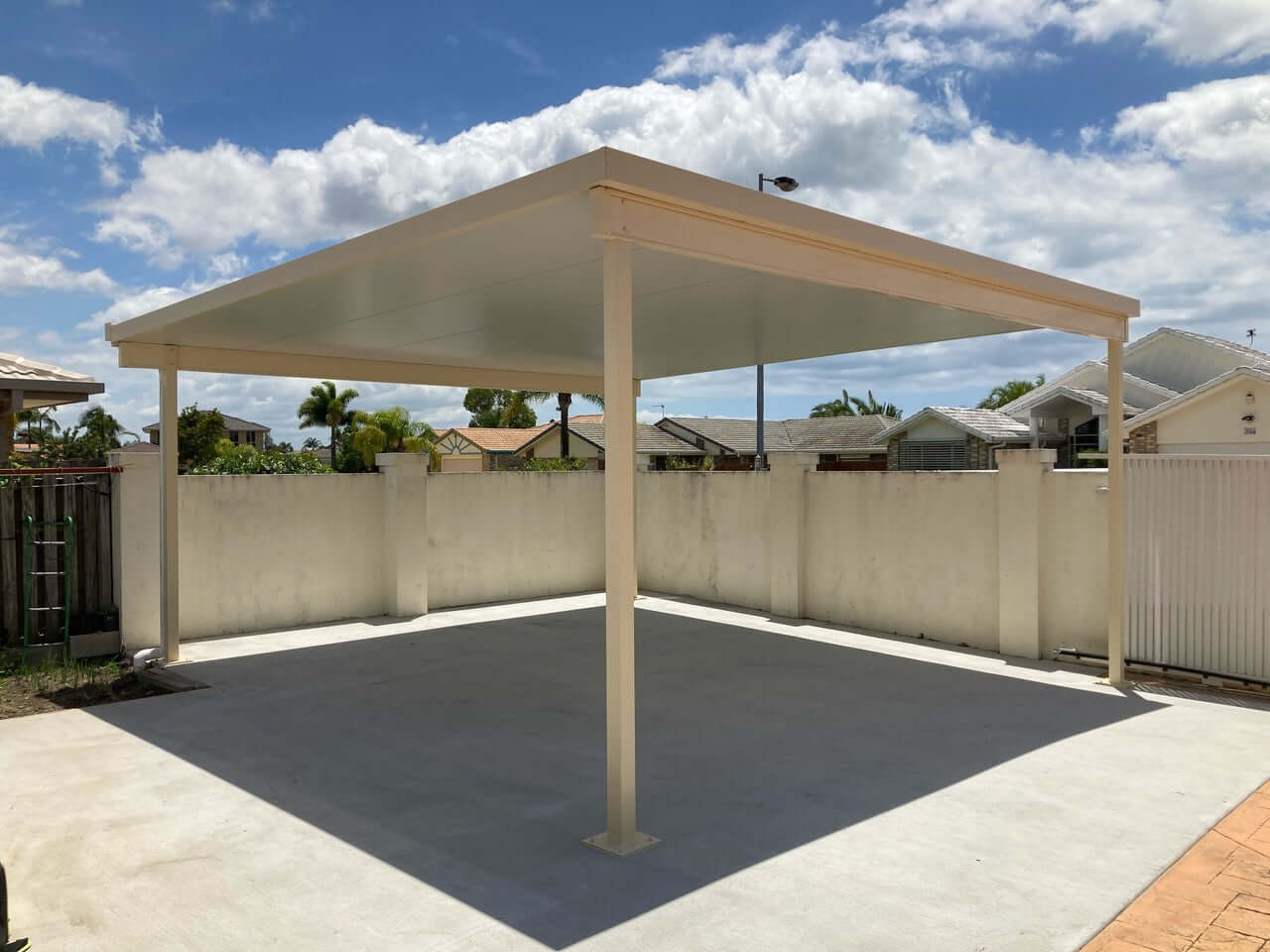 Freestanding insulated patio roof on a newly poured slab, ideally located for entertaining, relaxing, or any outdoor activity.