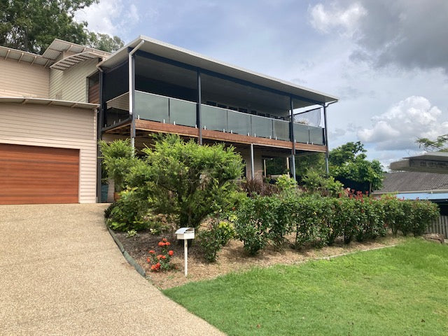  Insulated Patio Carport Attach Timber Fascia installed on a modern home with lush landscaping.