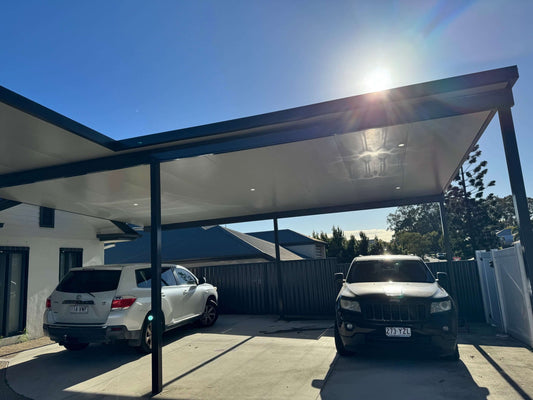 Stylish flyover carport with insulation, harmonizing with the house and shielding cars while allowing sunshine to filter through.