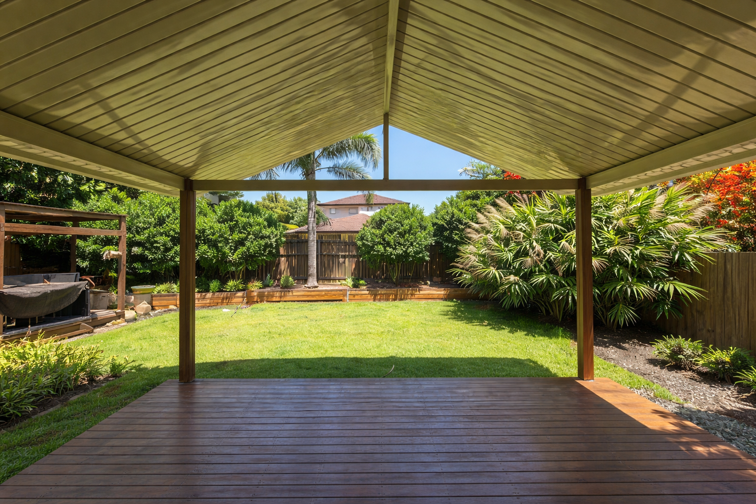 Gable-style patio roof with a pitched metal design - structured support for durable overhead coverage with a stylish finish.