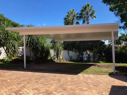 Freestanding insulated patio carport featuring a protective overhang, built to shield from sun and rain while enhancing outdoor living area.