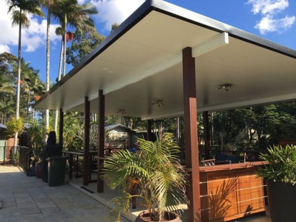 Insulated freestanding patio kits with flyover roof